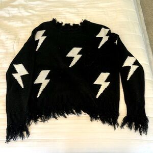Black with white lighting bolts, Rock and Rags sweater only wore a few times
